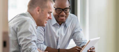 business men looking at tablet